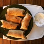 Taquitos with sour cream