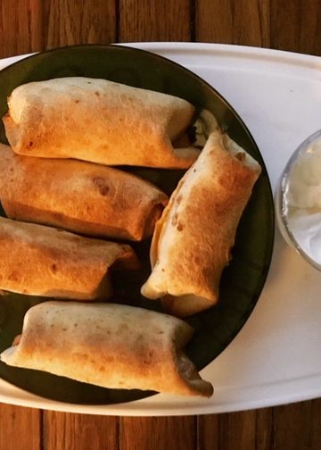 Taquitos with sour cream